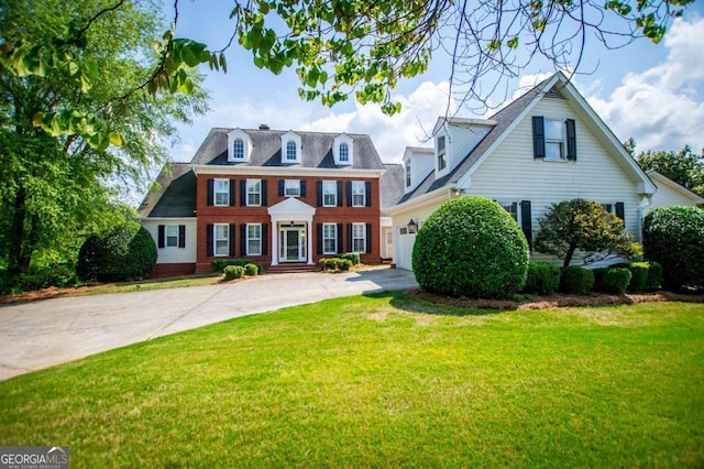 1745 Stripling Chapel Rd, Carrollton, GA 30116 - colonial inspired home featuring brick siding, driveway, a front yard, and a garage