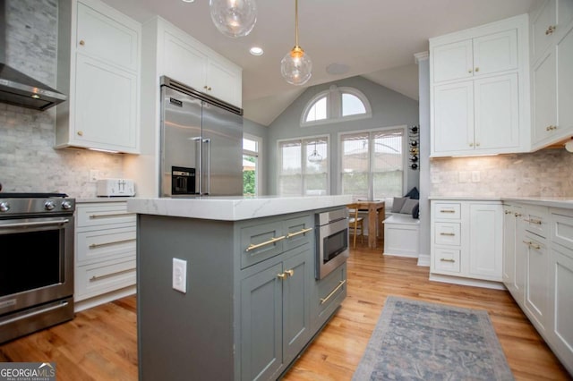 1745 Stripling Chapel Rd, Carrollton, GA 30116 - kitchen with white cabinets, built in appliances, wall chimney exhaust hood, tasteful backsplash, and gray cabinetry