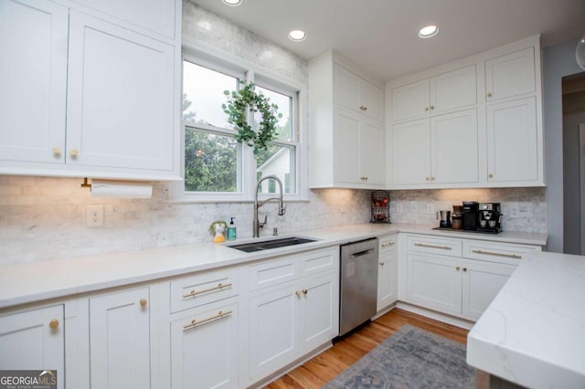 1745 Stripling Chapel Rd, Carrollton, GA 30116 - kitchen featuring a sink, stainless steel dishwasher, and white cabinetry