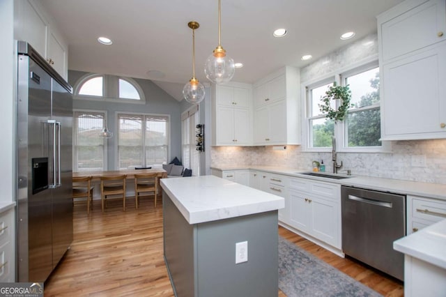1745 Stripling Chapel Rd, Carrollton, GA 30116 - kitchen featuring a sink, light countertops, stainless steel appliances, and light wood-style flooring