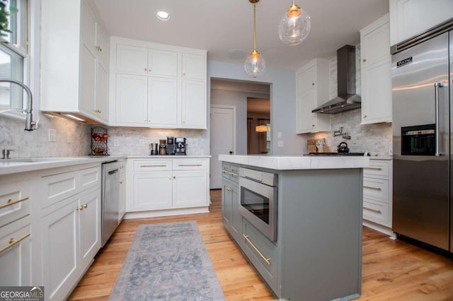 1745 Stripling Chapel Rd, Carrollton, GA 30116 - kitchen featuring decorative backsplash, a center island, recessed lighting, wall chimney exhaust hood, and stainless steel appliances