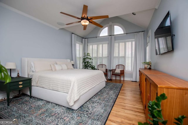 1745 Stripling Chapel Rd, Carrollton, GA 30116 - bedroom with light wood-style floors, ornamental molding, vaulted ceiling, and ceiling fan