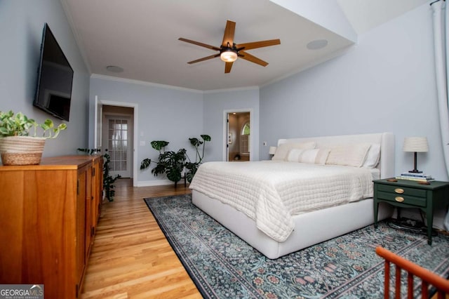 1745 Stripling Chapel Rd, Carrollton, GA 30116 - bedroom with crown molding, baseboards, and light wood-type flooring