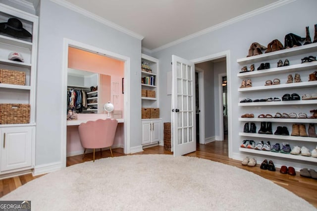 1745 Stripling Chapel Rd, Carrollton, GA 30116 - walk in closet with built in desk and wood finished floors