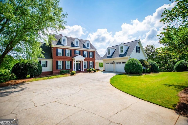 1745 Stripling Chapel Rd, Carrollton, GA 30116 - colonial home featuring brick siding, a garage, a front lawn, and concrete driveway