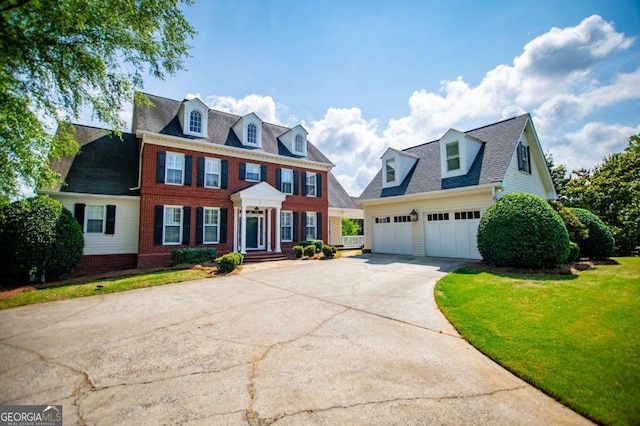1745 Stripling Chapel Rd, Carrollton, GA 30116 - colonial inspired home with brick siding, driveway, and a front yard