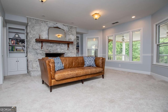 1745 Stripling Chapel Rd, Carrollton, GA 30116 - carpeted living room with baseboards, a fireplace, and visible vents