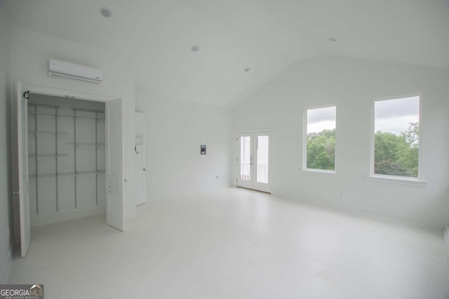 1745 Stripling Chapel Rd, Carrollton, GA 30116 - unfurnished living room with a wall mounted air conditioner and vaulted ceiling