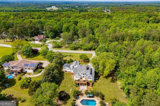 1745 Stripling Chapel Rd, Carrollton, GA 30116 - drone / aerial view featuring a wooded view