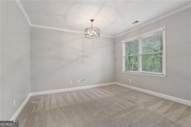 carpeted empty room featuring crown molding, baseboards, an inviting chandelier, and visible vents