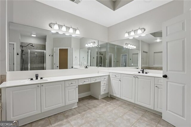 full bathroom with vanity and a shower stall