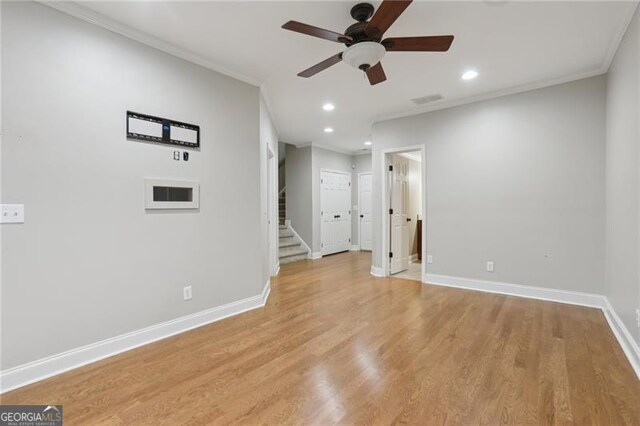 spare room with crown molding, a ceiling fan, baseboards, and recessed lighting