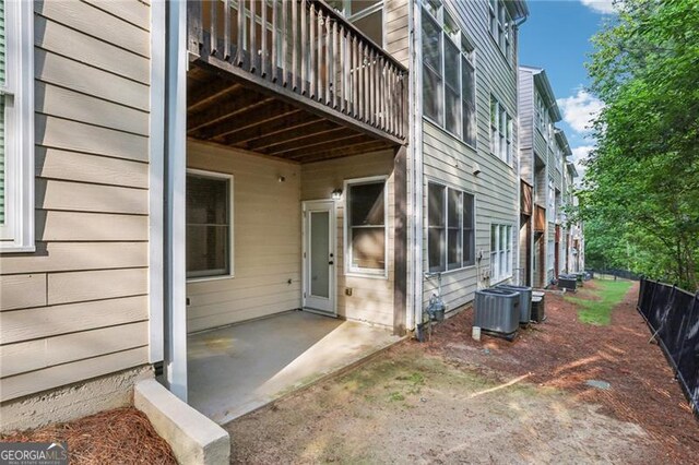 exterior space featuring central AC unit and a patio area