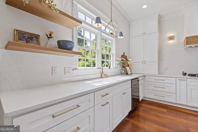 kitchen with dark wood-type flooring, a sink, white cabinets, and recessed lighting