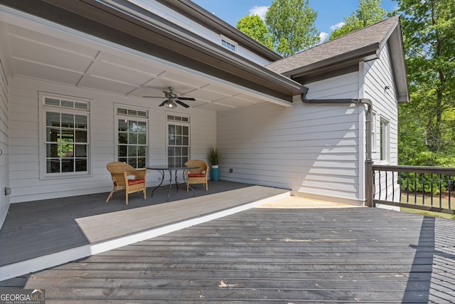wooden deck featuring a ceiling fan