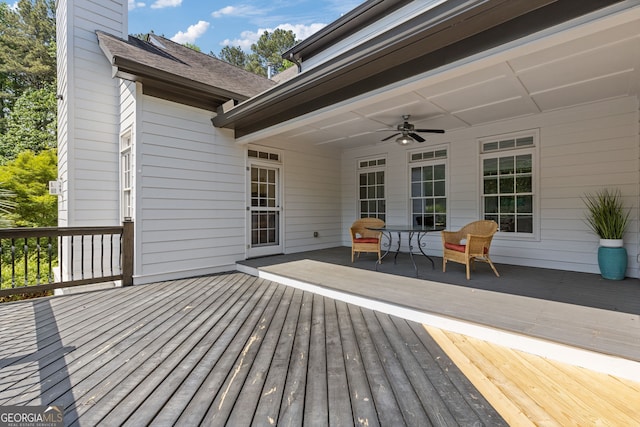 wooden terrace featuring ceiling fan