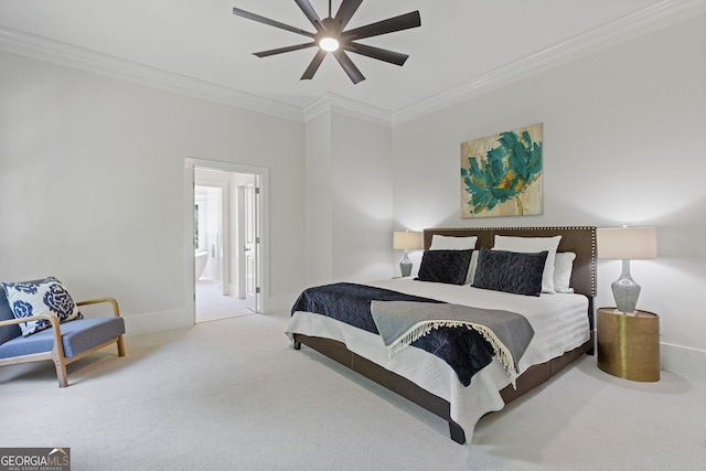 carpeted bedroom with a ceiling fan, baseboards, ornamental molding, and ensuite bathroom