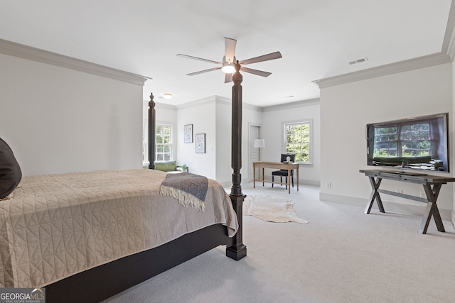 carpeted bedroom with visible vents, ornamental molding, and baseboards