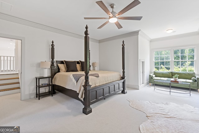 bedroom with baseboards, ornamental molding, carpet, and a ceiling fan