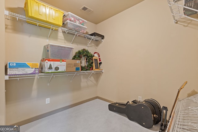 spacious closet featuring visible vents and carpet