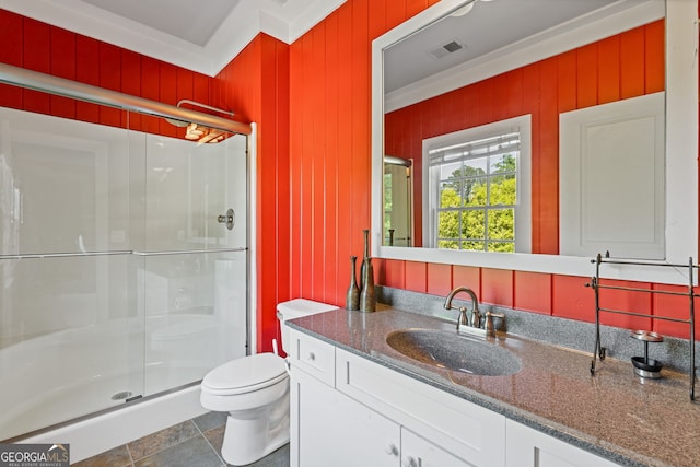 bathroom featuring vanity, visible vents, toilet, and a shower stall