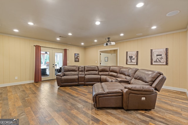 living area with crown molding, baseboards, french doors, and hardwood / wood-style flooring