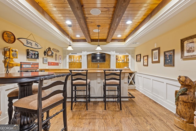 bar featuring wood ceiling, wainscoting, indoor wet bar, light wood-style floors, and recessed lighting