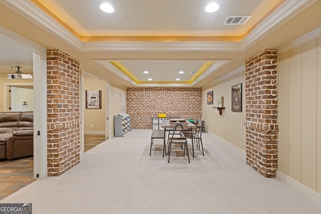 carpeted dining space featuring recessed lighting, visible vents, ornamental molding, and a raised ceiling