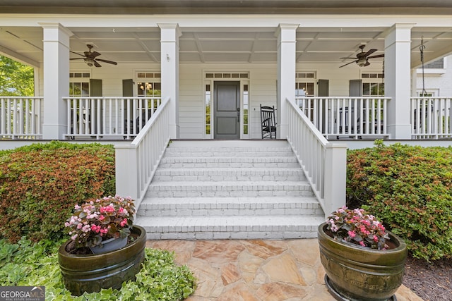 entrance to property featuring a porch and ceiling fan