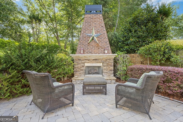 view of patio / terrace with an outdoor stone fireplace