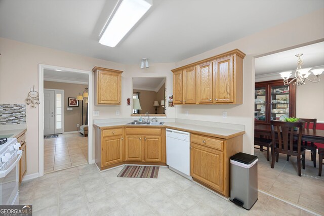 kitchen featuring crown molding, a sink, white appliances, light countertops, and a chandelier