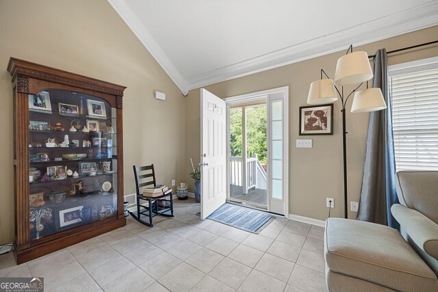 doorway with crown molding, light tile patterned flooring, baseboards, and lofted ceiling