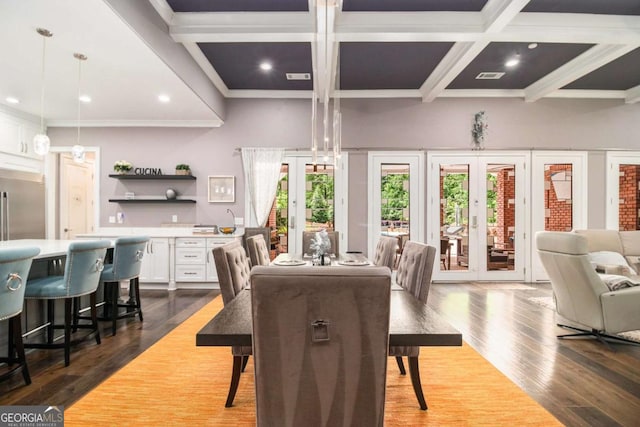 dining area featuring french doors, coffered ceiling, dark wood-type flooring, and beamed ceiling