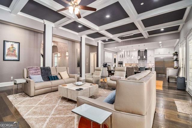 living area featuring baseboards, dark wood-type flooring, coffered ceiling, and ceiling fan