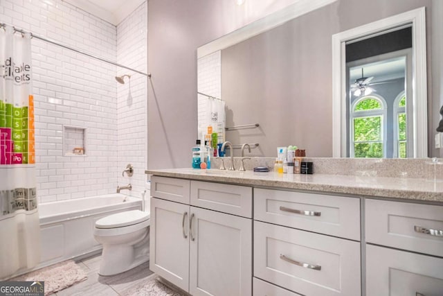 bathroom featuring toilet, shower / bathtub combination with curtain, and vanity