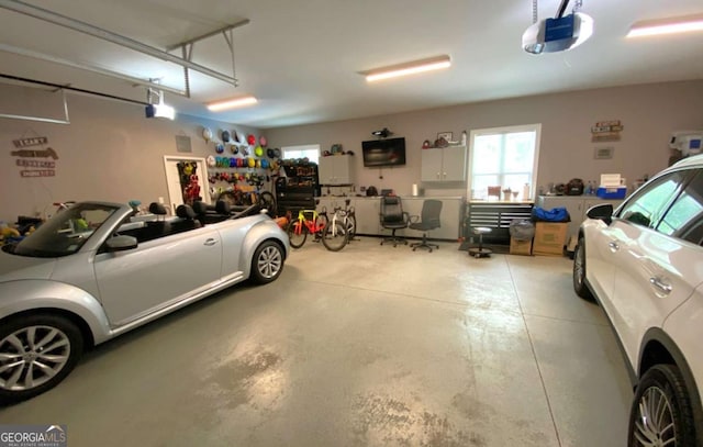 garage featuring a garage door opener