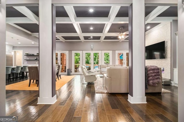 living area with ceiling fan, beamed ceiling, coffered ceiling, and hardwood / wood-style flooring