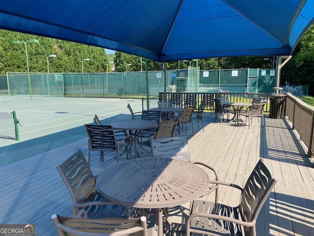 wooden deck featuring fence and outdoor dining area