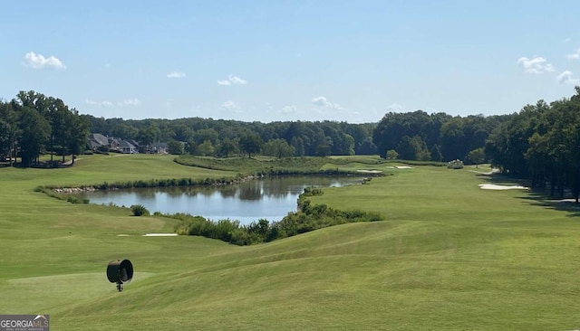 view of property's community with a water view and golf course view