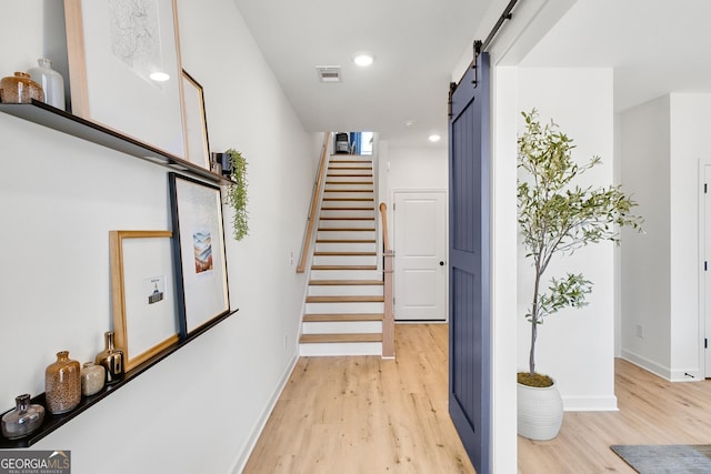 208 Village Overlook Unit J3, Canton, GA 30114 - stairway featuring wood finished floors, a barn door, baseboards, and recessed lighting