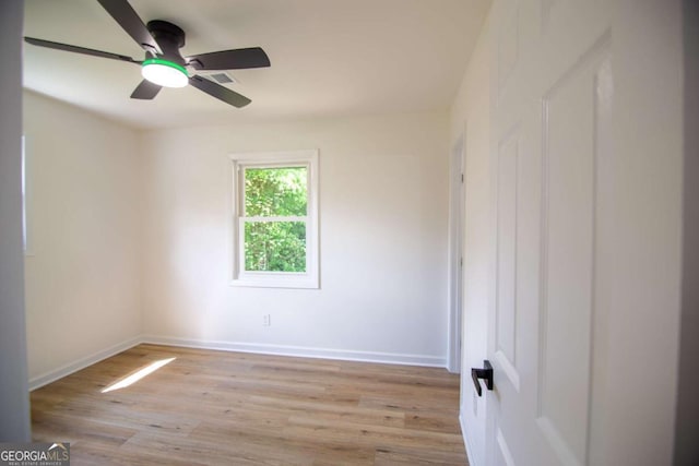 4074 Green Hawk Trl, Decatur, GA 30035 - unfurnished room featuring light wood-style flooring, ceiling fan, and baseboards