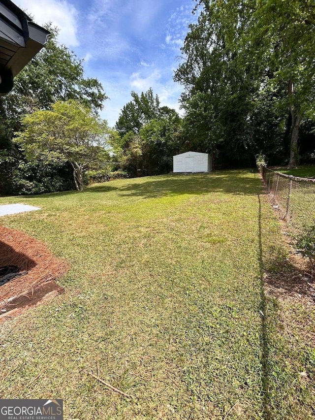 4074 Green Hawk Trl, Decatur, GA 30035 - view of yard featuring a shed and an outbuilding