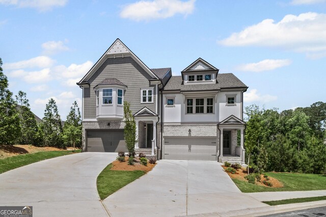 203 Retreat Ln, Canton, GA 30114 - view of front of house featuring a garage, driveway, and a shingled roof
