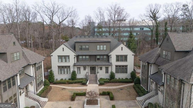 view of front facade featuring roof with shingles