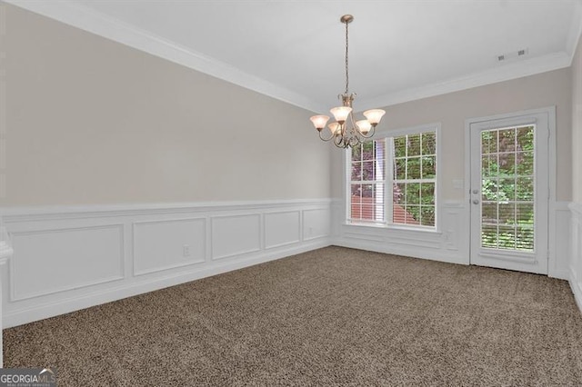 735 Scenic Creek Dr, Lawrenceville, GA 30046 - carpeted empty room featuring a wainscoted wall, crown molding, a chandelier, and a decorative wall