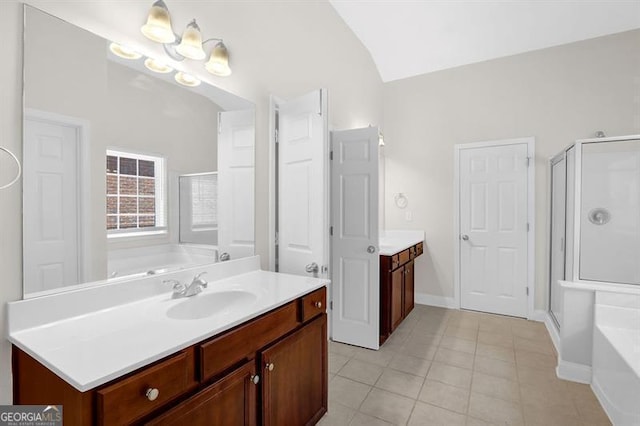 735 Scenic Creek Dr, Lawrenceville, GA 30046 - bathroom featuring a garden tub, vanity, a shower stall, tile patterned flooring, and vaulted ceiling