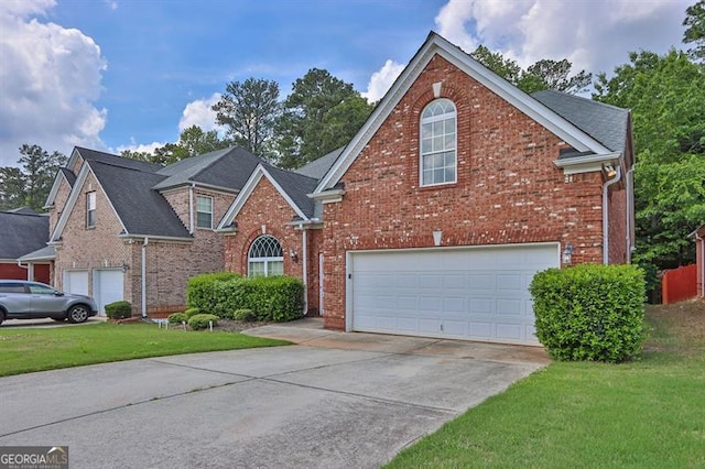 735 Scenic Creek Dr, Lawrenceville, GA 30046 - traditional home featuring a garage, brick siding, driveway, and a front yard