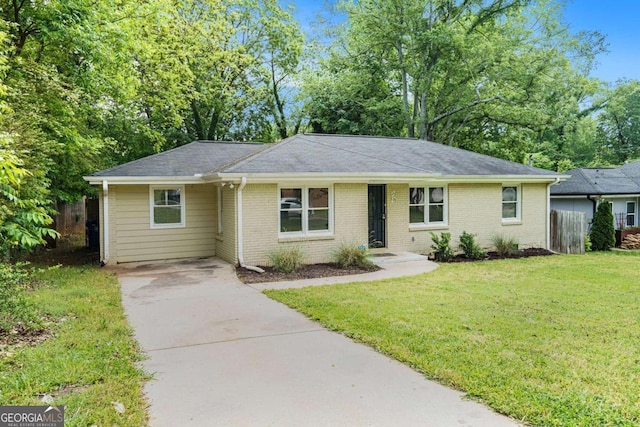ranch-style house with driveway, brick siding, fence, a front lawn, and a shingled roof
