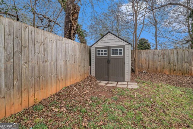 view of shed with a fenced backyard