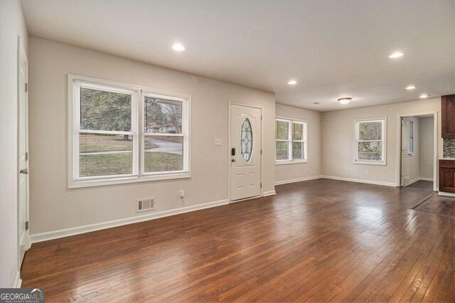 foyer entrance with recessed lighting, baseboards, visible vents, and dark wood-style floors